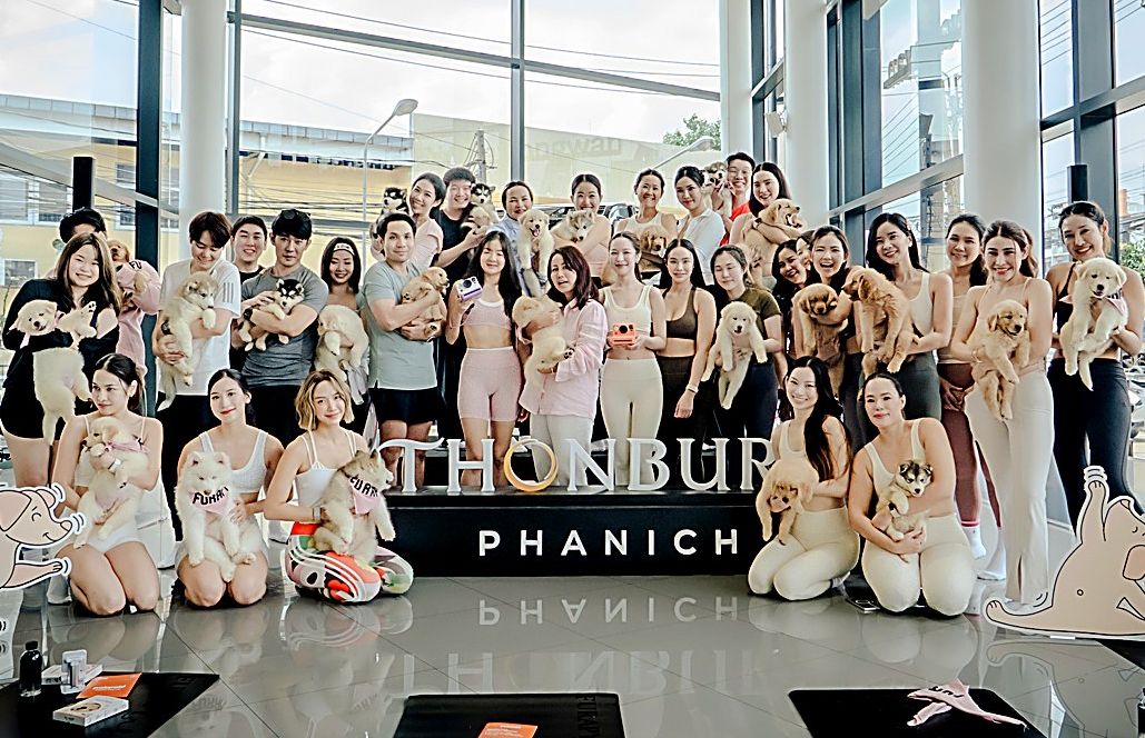 Group yoga event with puppies at Mercedes-Benz Thonburi Phanich