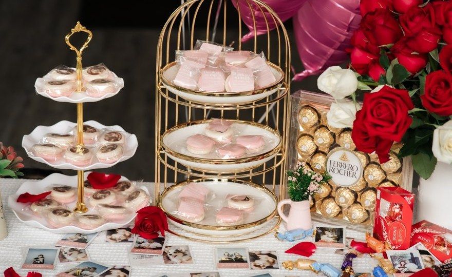 Party dessert table with macarons and Furapy polaroids
